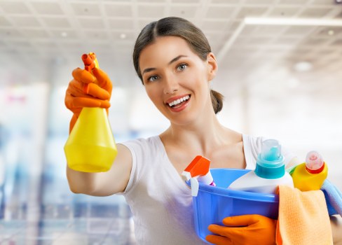 Kitchen domestic cleaning with surfaces being wiped and sanitized